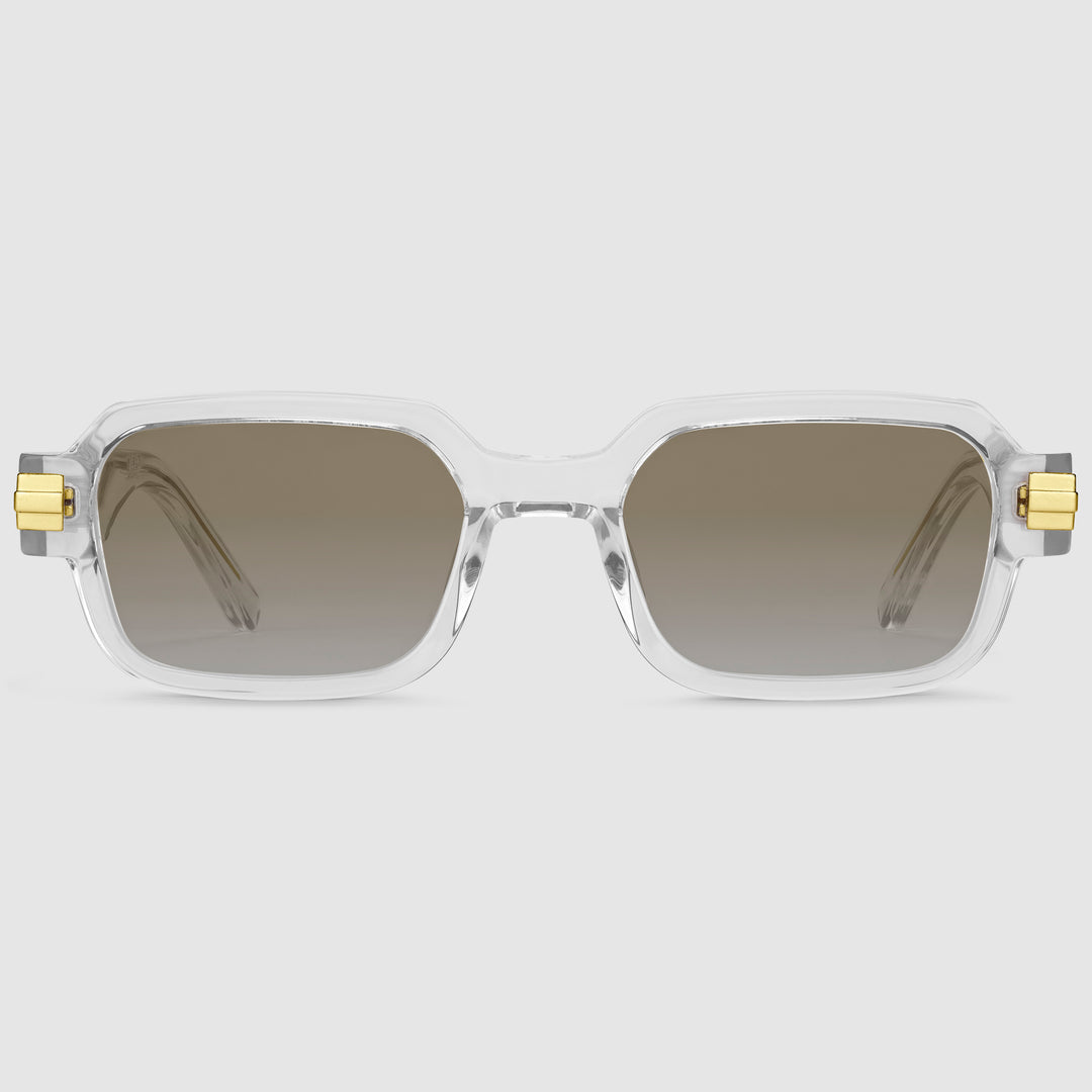 Luxora Midnight Unisex-Brille von Priolet – rechteckiger Rahmen in transparentem Design mit goldfarbenen Metallelementen und braunen, photochromen Verlaufsgläsern.