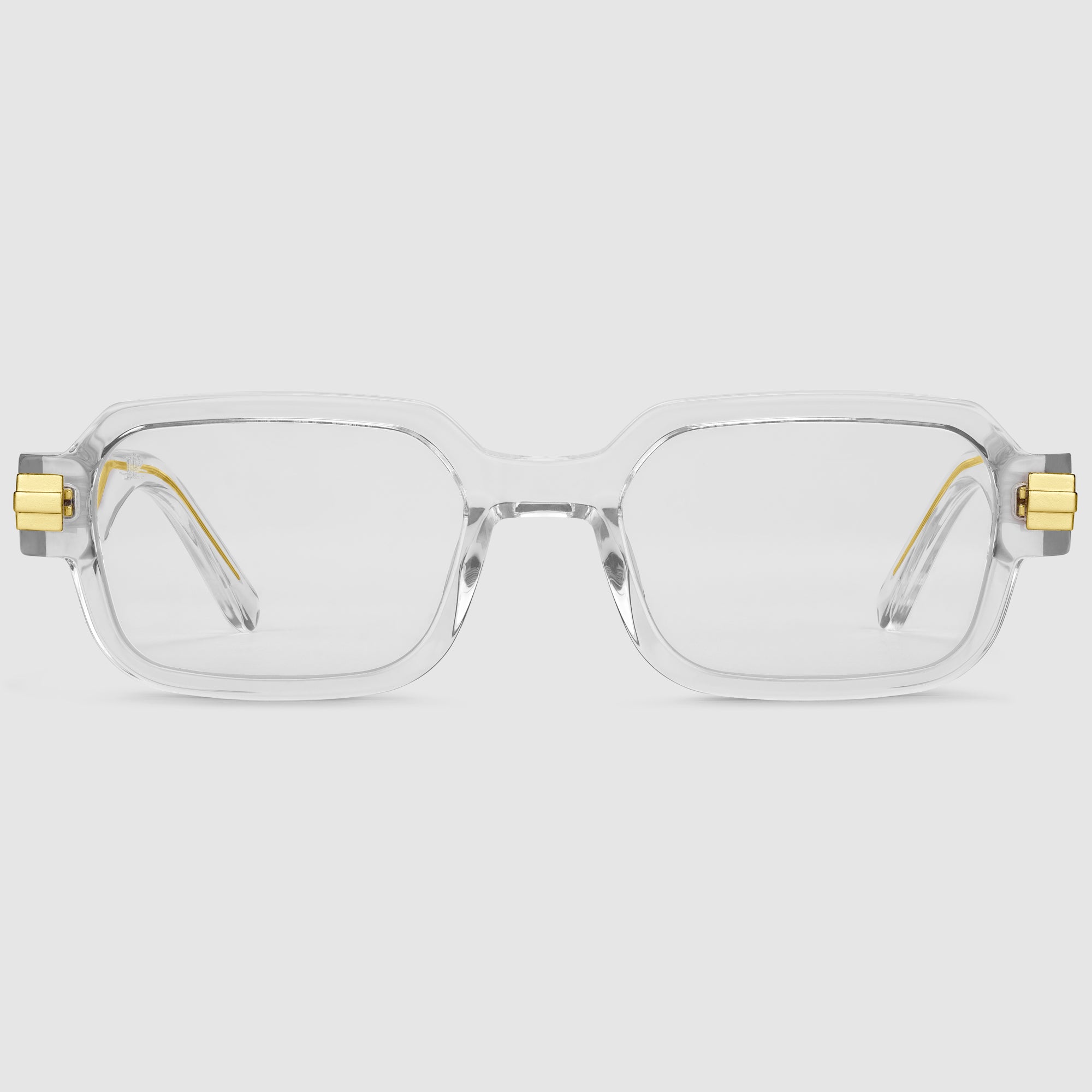 Luxora Midnight Unisex-Brille in Gold – Frontansicht mit klarem Acetatrahmen und goldfarbenen Metallelementen.